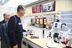 CHINA-BEIJING-TIENDA DE CONVENIENCIA-ROBOT