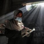 MEDIO ORIENTE-CIUDAD DE GAZA-BIBLIOTECA-VOLUNTARIAS