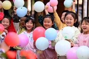 CHINA-DIA MUNDIAL DE LA SONRISA-EVENTOS
